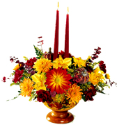 Miami Thanksgiving... This bouquet is the perfect recipe to complete your Thanksgiving table. We put together a great combination of Fall's best colors and flowers. All are decoratively arranged in a warm colored pedestal bowl. Two candles are included. 