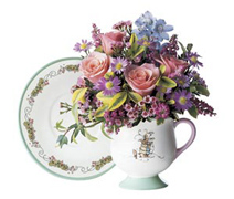 A delightful companion to the Peter Rabbit teapot, this adorable pedestal-base ceramic cup and saucer set offers a sure way to build multiple sales throughout the year.  Fresh spring flowers add a sprightly touch.